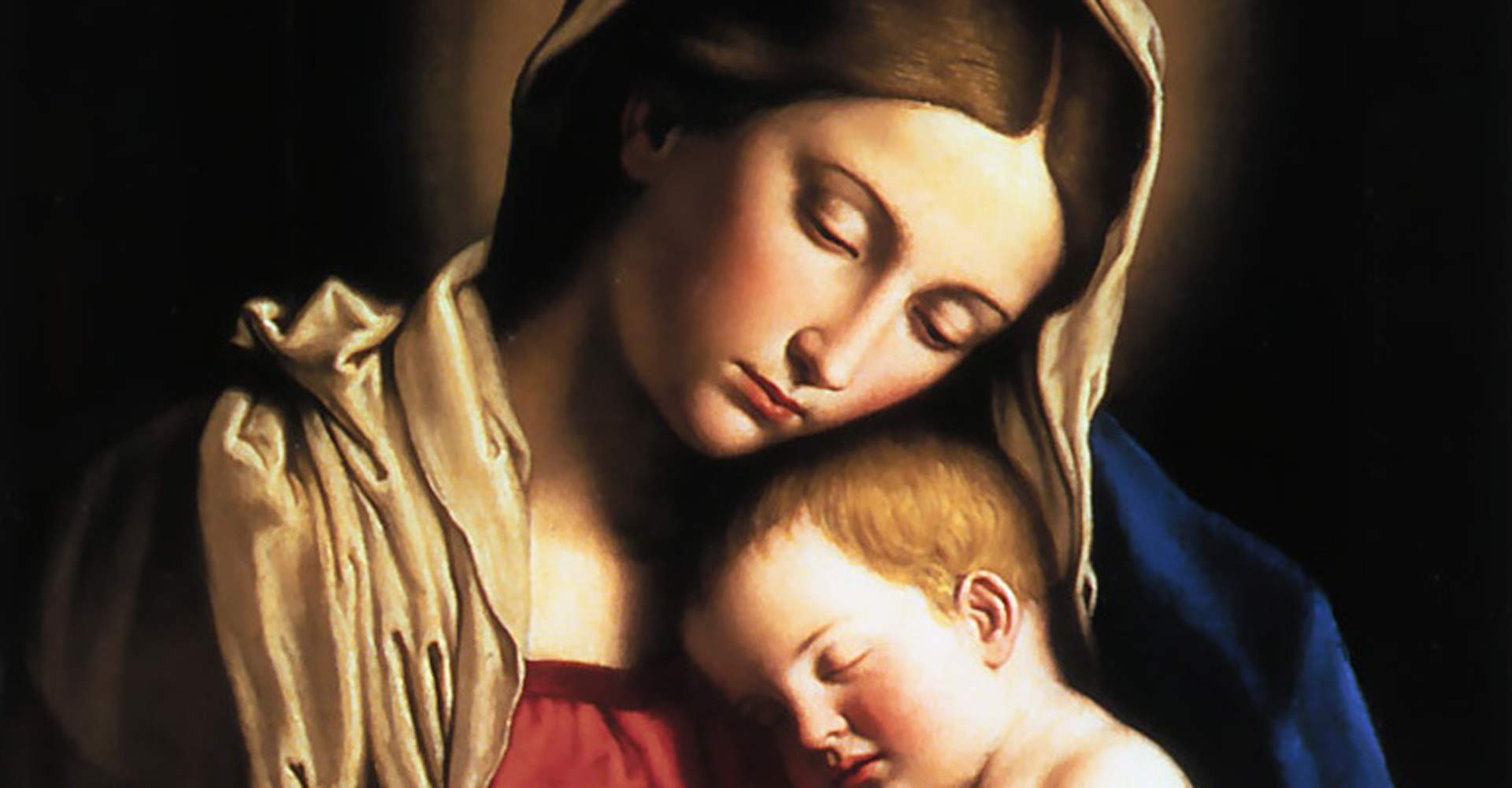 Mary holds the infant Jesus
